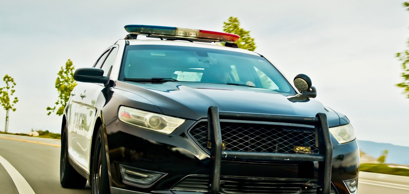 Police patrol car driving toward the camera